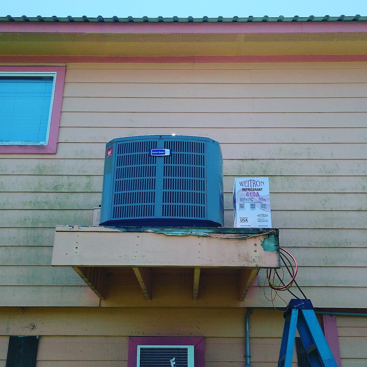 Trane condenser unit installed on a building exterior