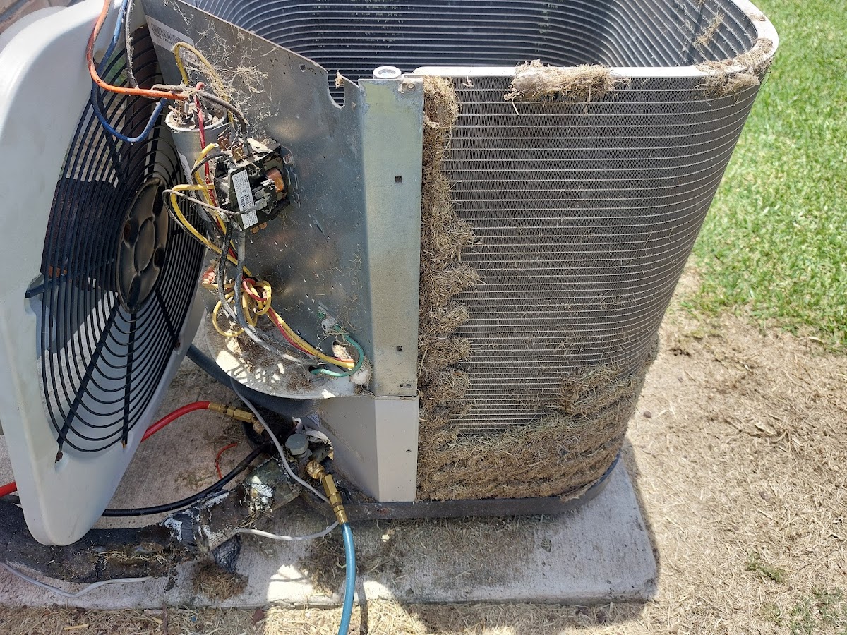 James servicing an open AC unit